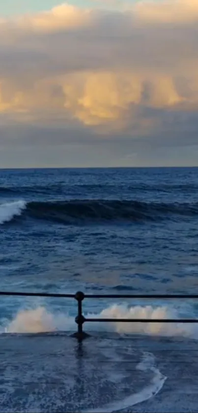 Ocean waves crash under a golden sunset sky.