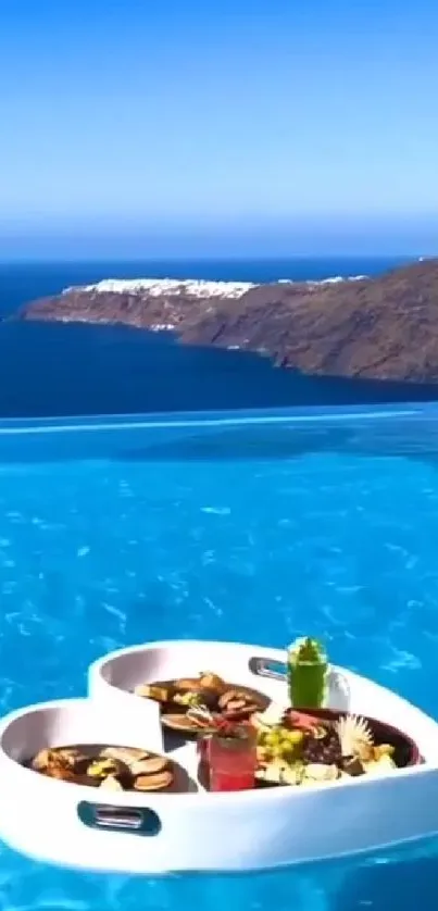 Infinity pool with ocean view and breakfast tray.