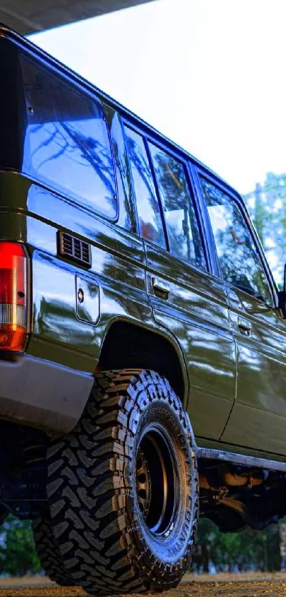 Olive green 4x4 SUV parked for off-road exploration.