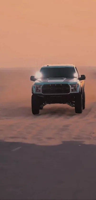 Off-road truck driving through desert at sunset with sand dunes in background.