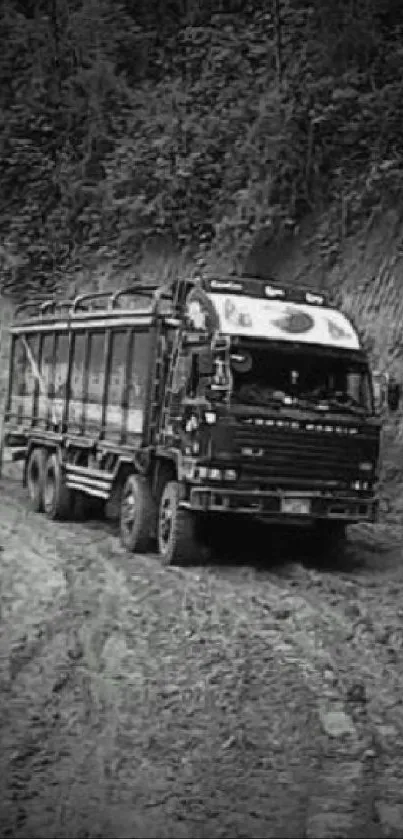 Monochrome image of a truck on a muddy off-road path.