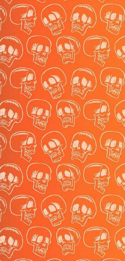 Vibrant orange wallpaper featuring a repeating skull pattern.