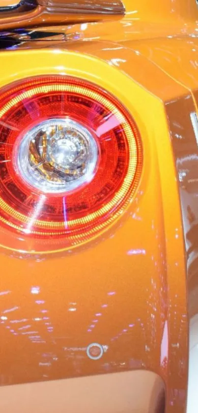 Close-up of orange sports car tail light.