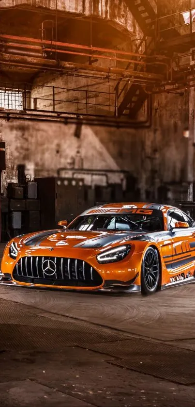 Orange sports car in an industrial warehouse setting.