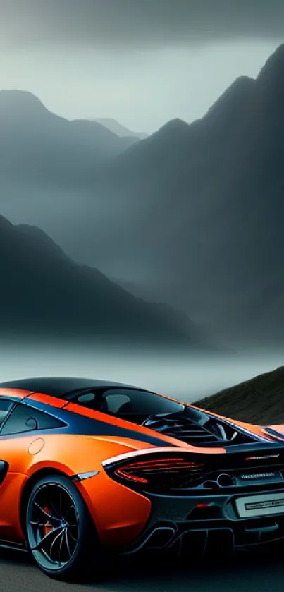 Orange supercar parked in front of misty mountain landscape.