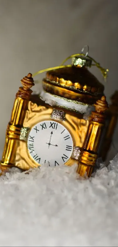 Golden clock ornament on snow background.