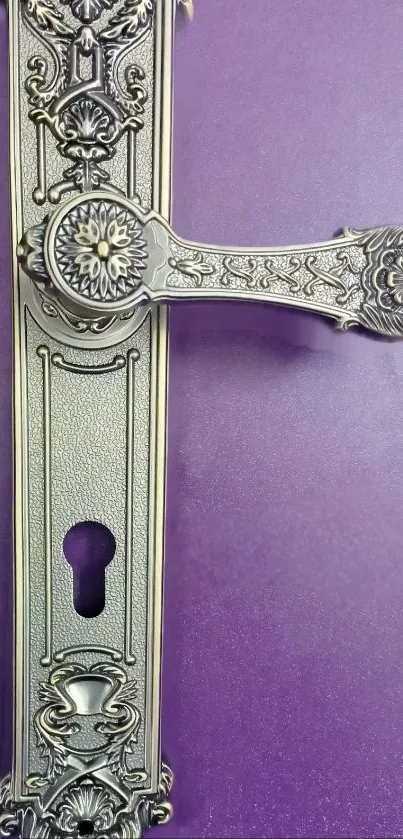 Ornate door handle on purple background wallpaper.