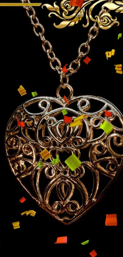 Ornate heart pendant on black with colorful confetti.