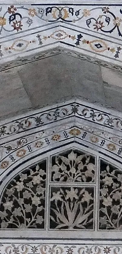 Intricate marble arch with floral details.