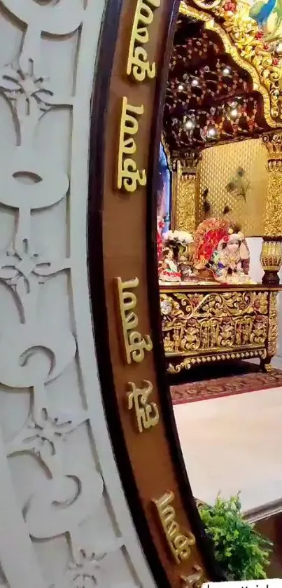 Ornate temple mirror reflecting golden details and cultural artistry.