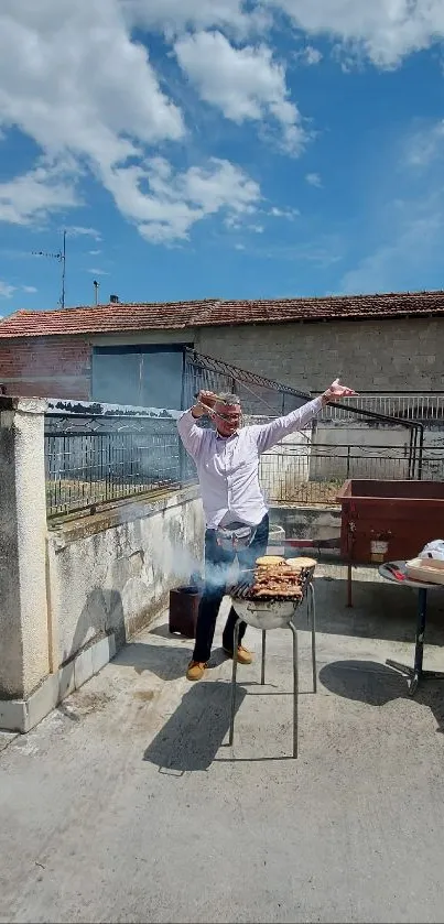 Joyful man cooking at barbecue with blue skies.