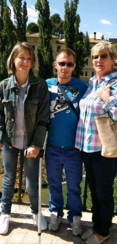 Family portrait outdoors with scenic backdrop.