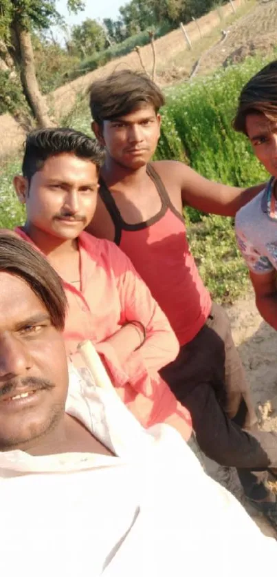 Group of friends enjoying a sunny day outdoors in a field.