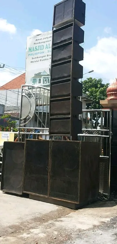 Powerful outdoor speaker setup in cityscape.