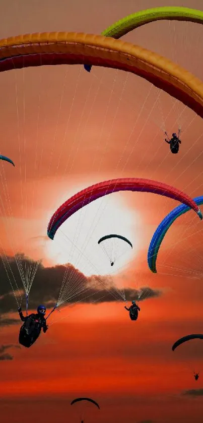 Colorful paragliders soar across a vibrant sunset sky.