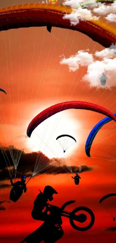 Paragliding against a vibrant orange sunset.