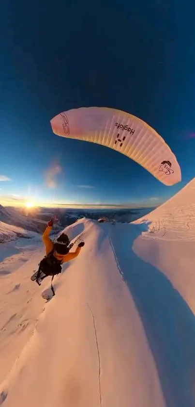 Paraglider soaring over snowy mountains at sunset, capturing breathtaking adventure.