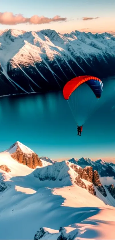 Paraglider flying over snow-capped mountains under a cyan sky.