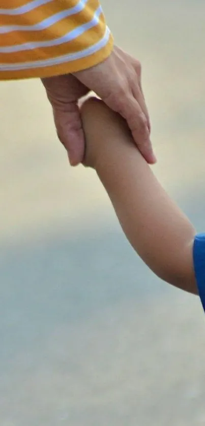 Parent holding child's hand in a moment of trust.