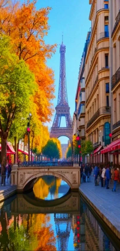 Eiffel Tower with autumn leaves by a Parisian street and canal.