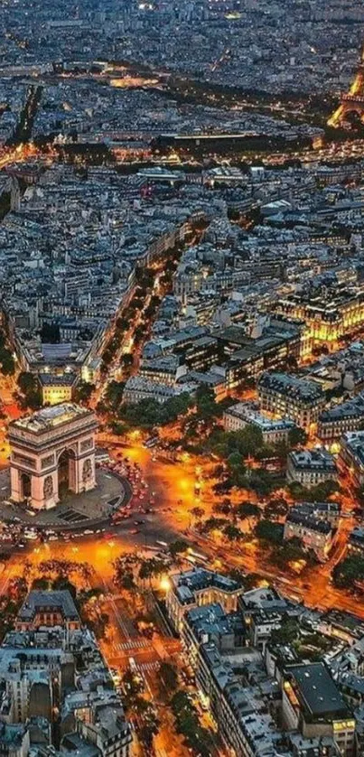 Aerial view of Paris cityscape at night with glowing Eiffel Tower.