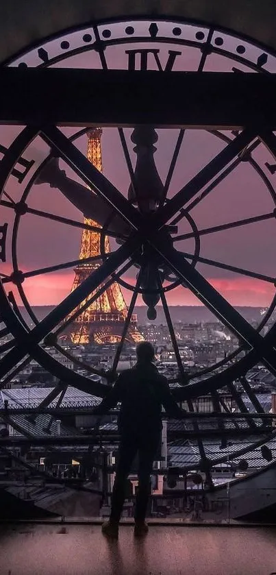 View of Eiffel Tower through a clock face at sunset in Paris.