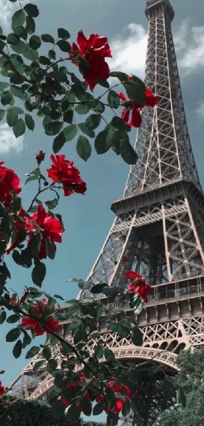 Elegant Eiffel Tower with vivid red roses foreground under a crisp blue sky.