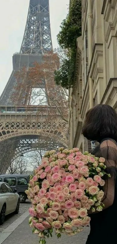 Woman with roses near Eiffel Tower in Paris.