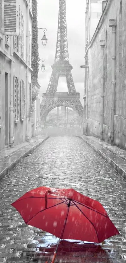 Paris street with red umbrella and Eiffel Tower in black and white.