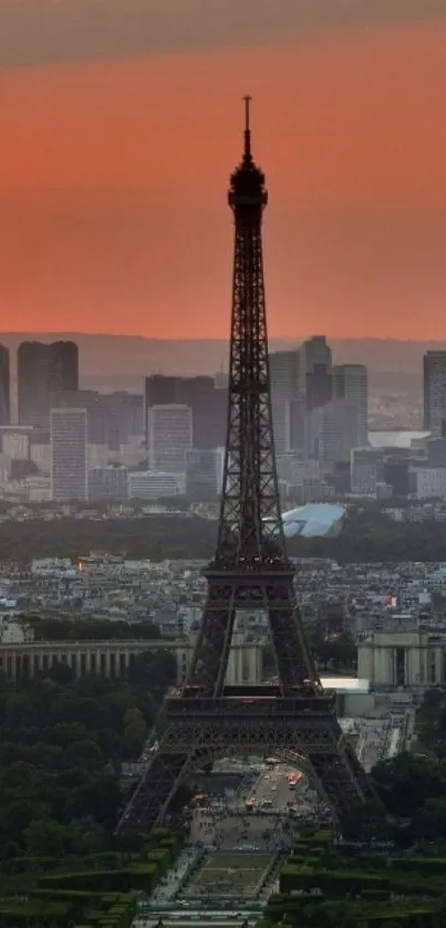 Eiffel Tower at sunset with Paris skyline in the background creating a serene view.