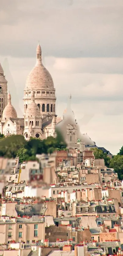 Paris skyline featuring Sacré-Cœur Basilica with Montmartre rooftops.