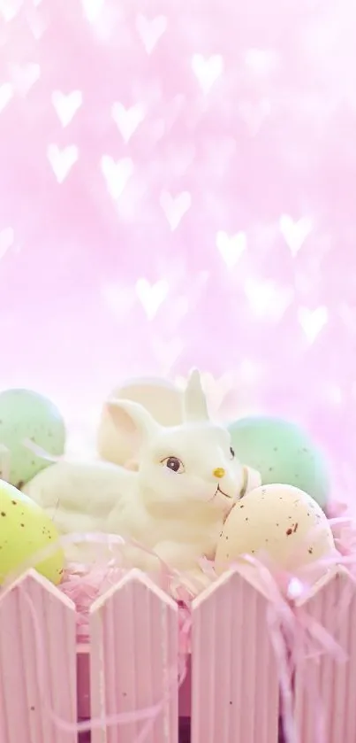 White bunny and pastel eggs on pink bokeh background.