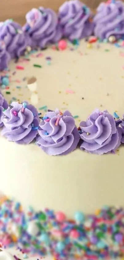 Lavender frosted cake with colorful sprinkles and decorative border.