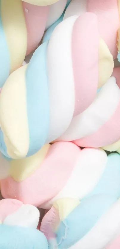 Pastel candy swirl wallpaper with pink, blue, yellow, and white colors.