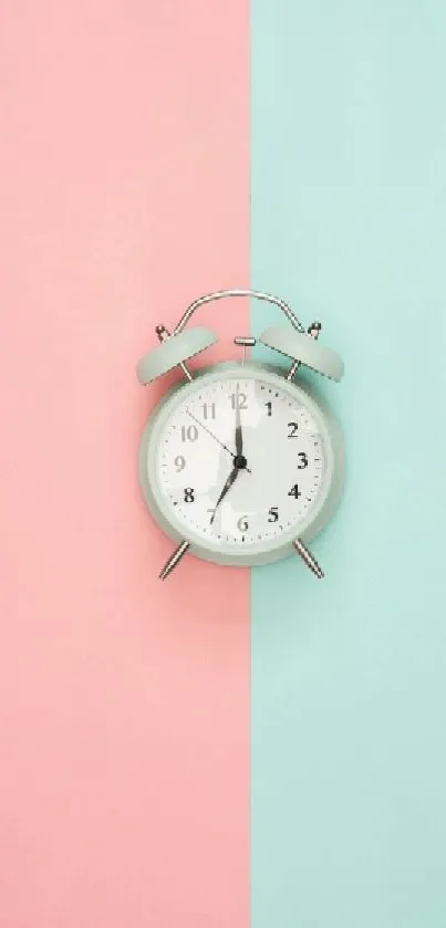 Pastel pink and mint split wallpaper with a vintage clock.