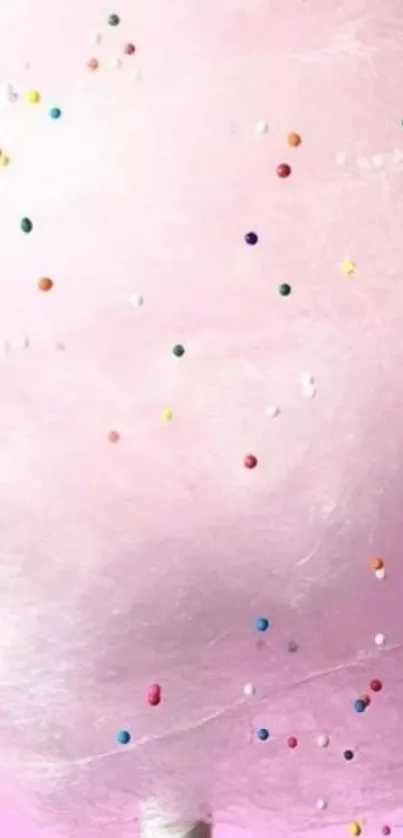 Whimsical pink cotton candy wallpaper with colorful sprinkles.