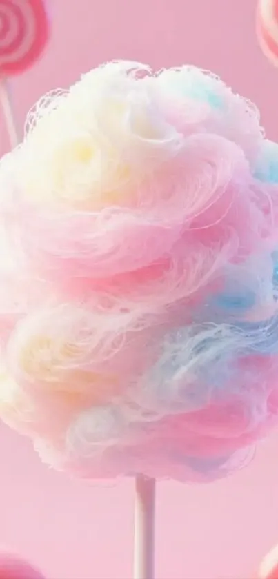 Fluffy pastel cotton candy on a pink background.