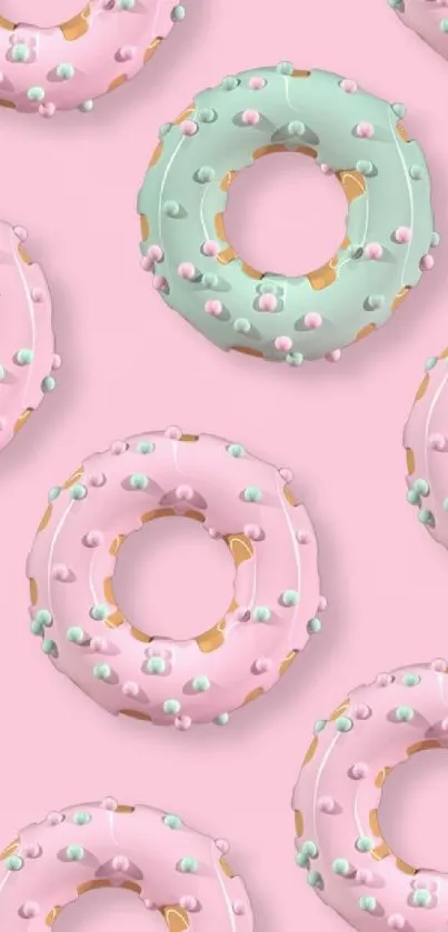 Pastel donuts pattern with pink background.