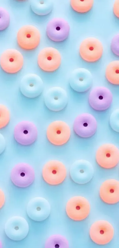 Colorful pastel donuts wallpaper with light blue background.