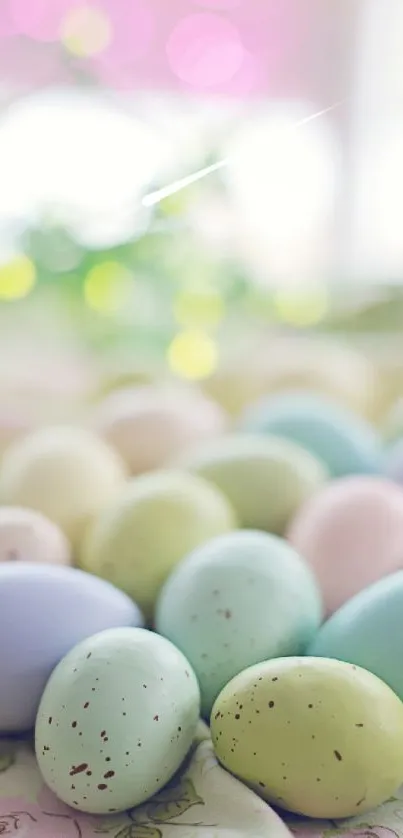 Pastel-colored Easter eggs scattered on a soft, blurred background.