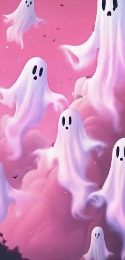 Pastel ghost illustrations floating in pink clouded sky wallpaper.