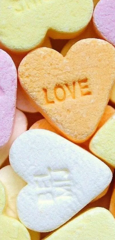 Pastel heart candies with love messages in vibrant shades.