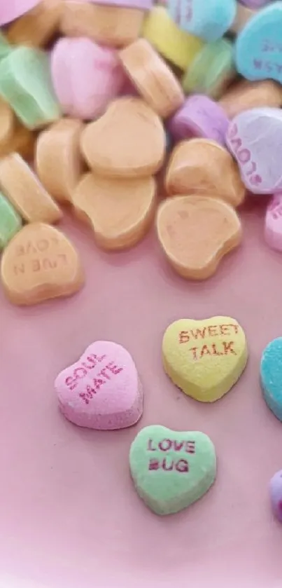 Pastel candy hearts on a pink plate wallpaper.