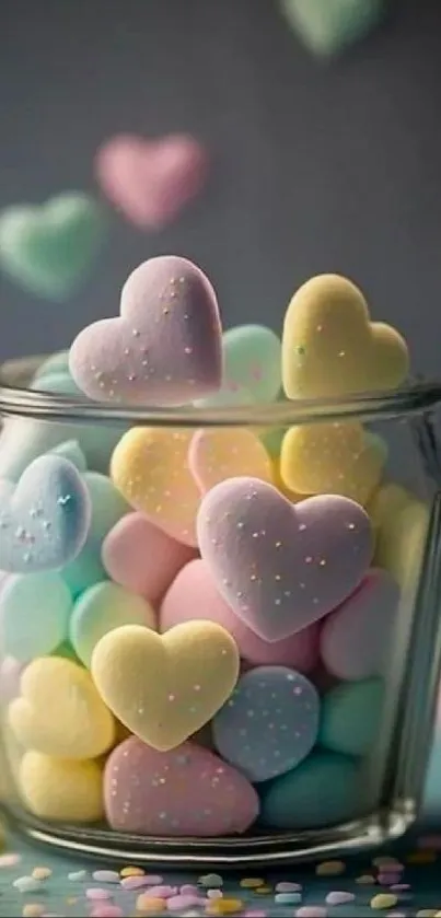 A jar filled with pastel-colored heart candies on a soft background.