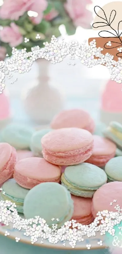 Pastel macarons with pink roses in a dreamy floral design wallpaper.