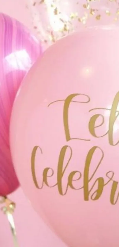 Pink celebration balloons with gold script.