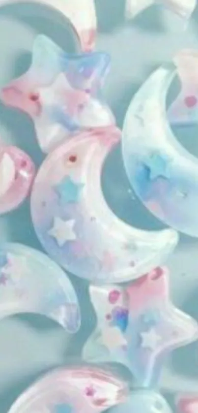 Pastel stars and moons wallpaper in soft blue and pink hues.