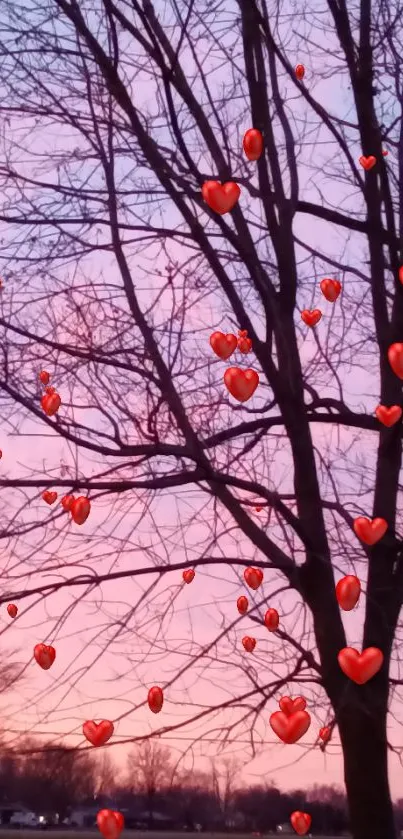 Pastel pink sunset with tree silhouettes.