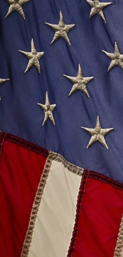 Close-up of American flag with stars and stripes on mobile wallpaper.