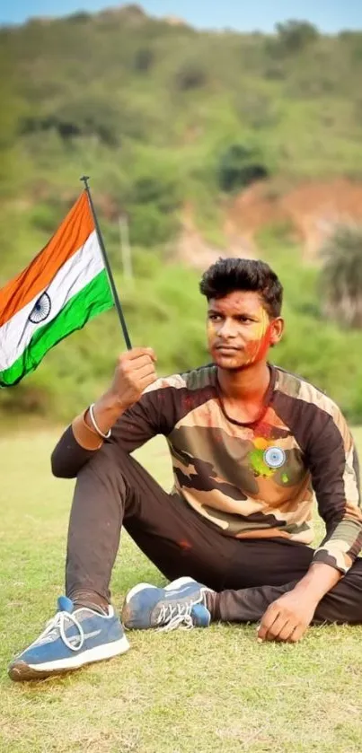 Young man with Indian flag in nature setting.